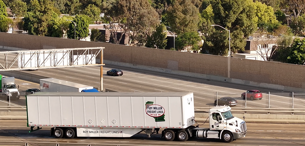 Roy Miller Freight Lines tractors in front of the company facility